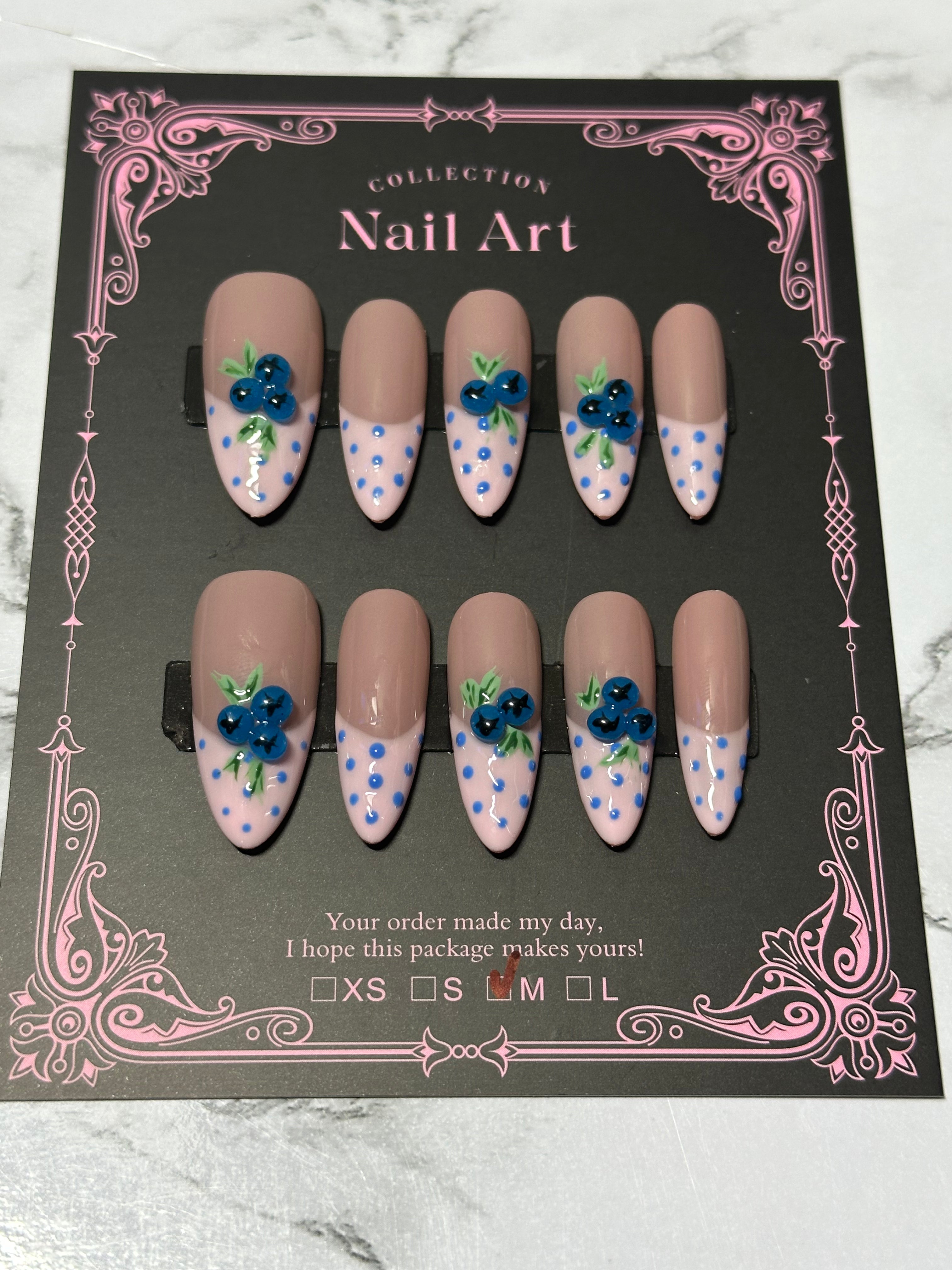 blueberry and pink French with blue polka dot nail